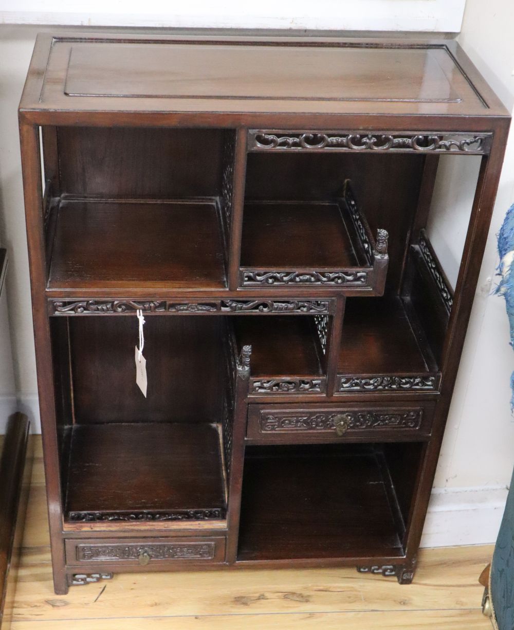 A Chinese carved wood open display cabinet, W.60cm, D.28cm, H.84cm
